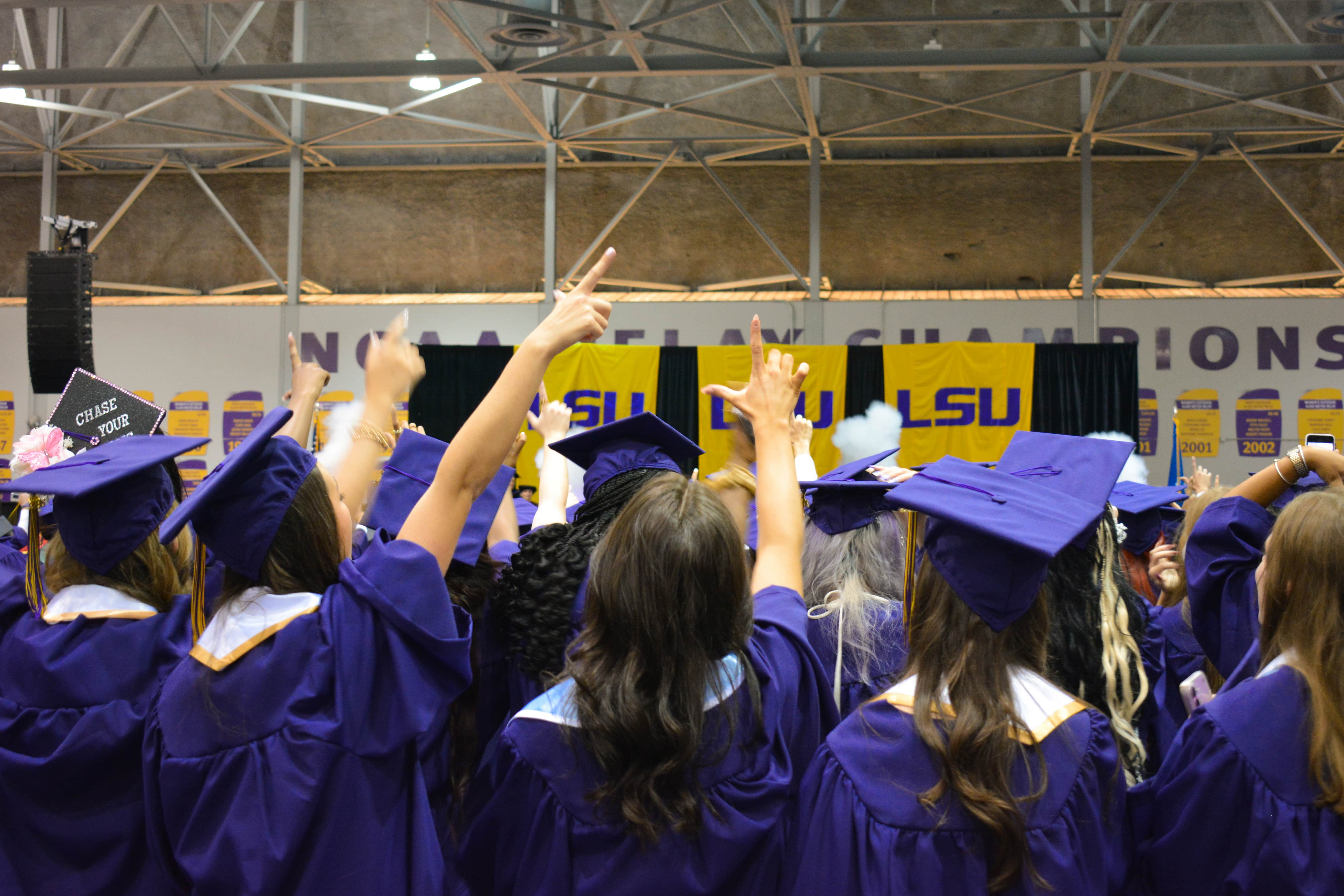 Grads celebrating during the Alma Mater.