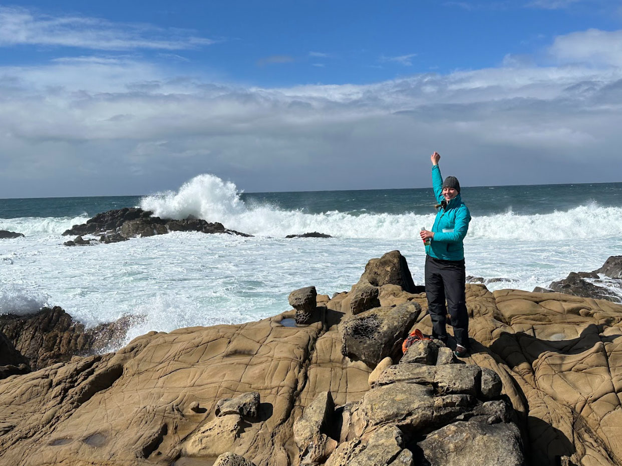 Isabelle Neylan doing research in a coastal setting