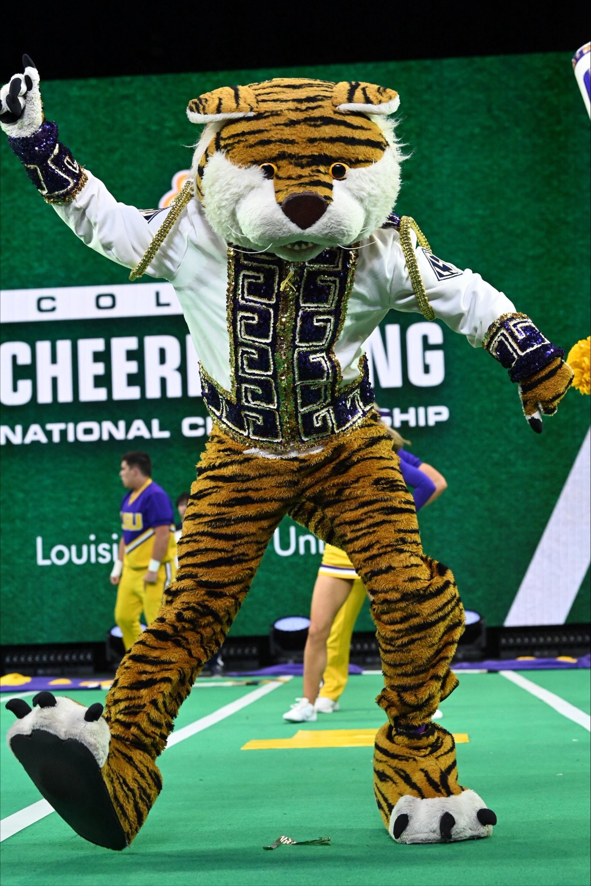 Mike the Tiger performs during a collegiate cheer and mascot competition. Mike the Tiger performs during a collegiate cheer and mascot competition.