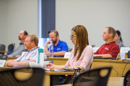 Students in class listening to lecture