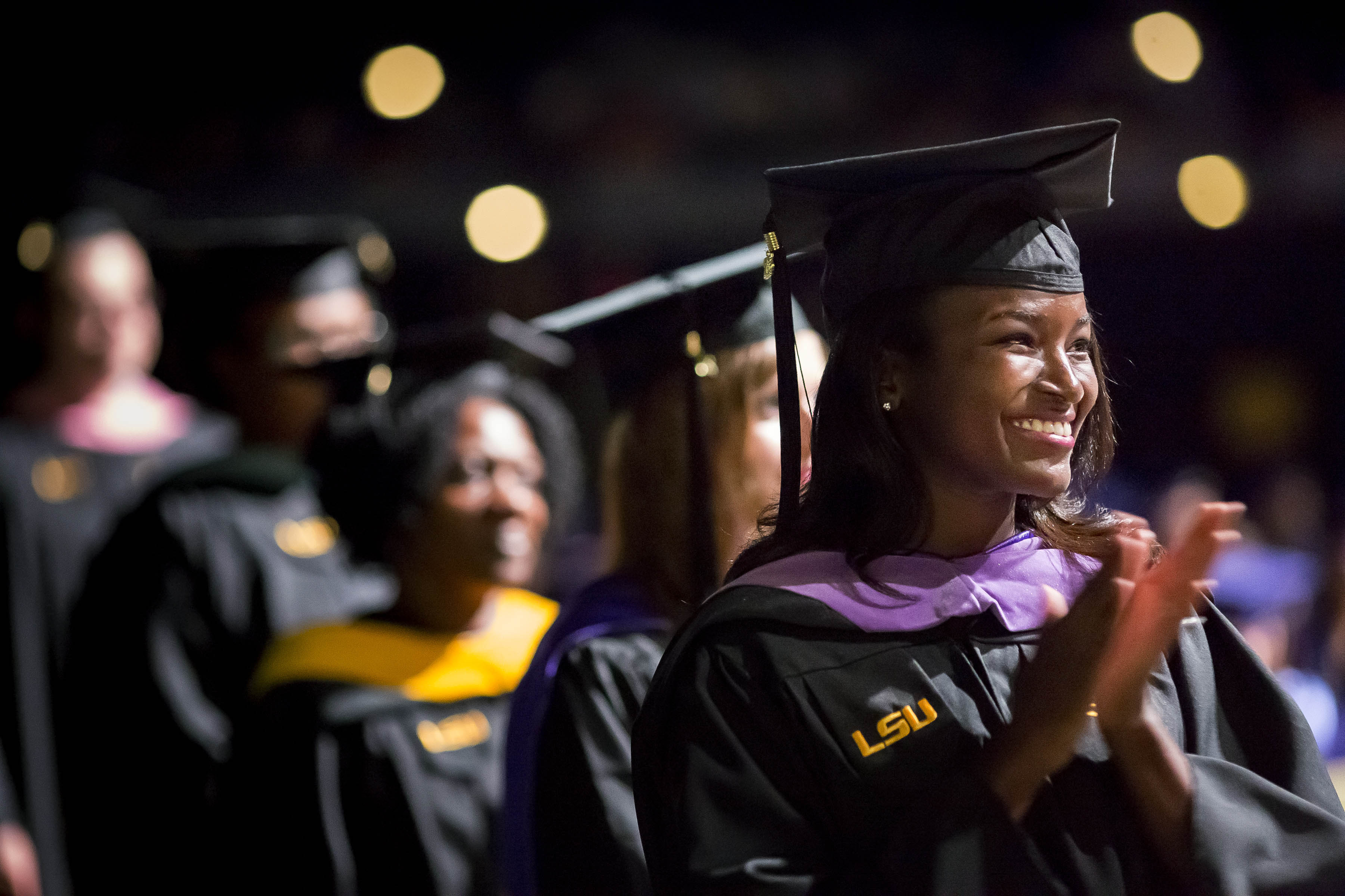 masters graduate clapping