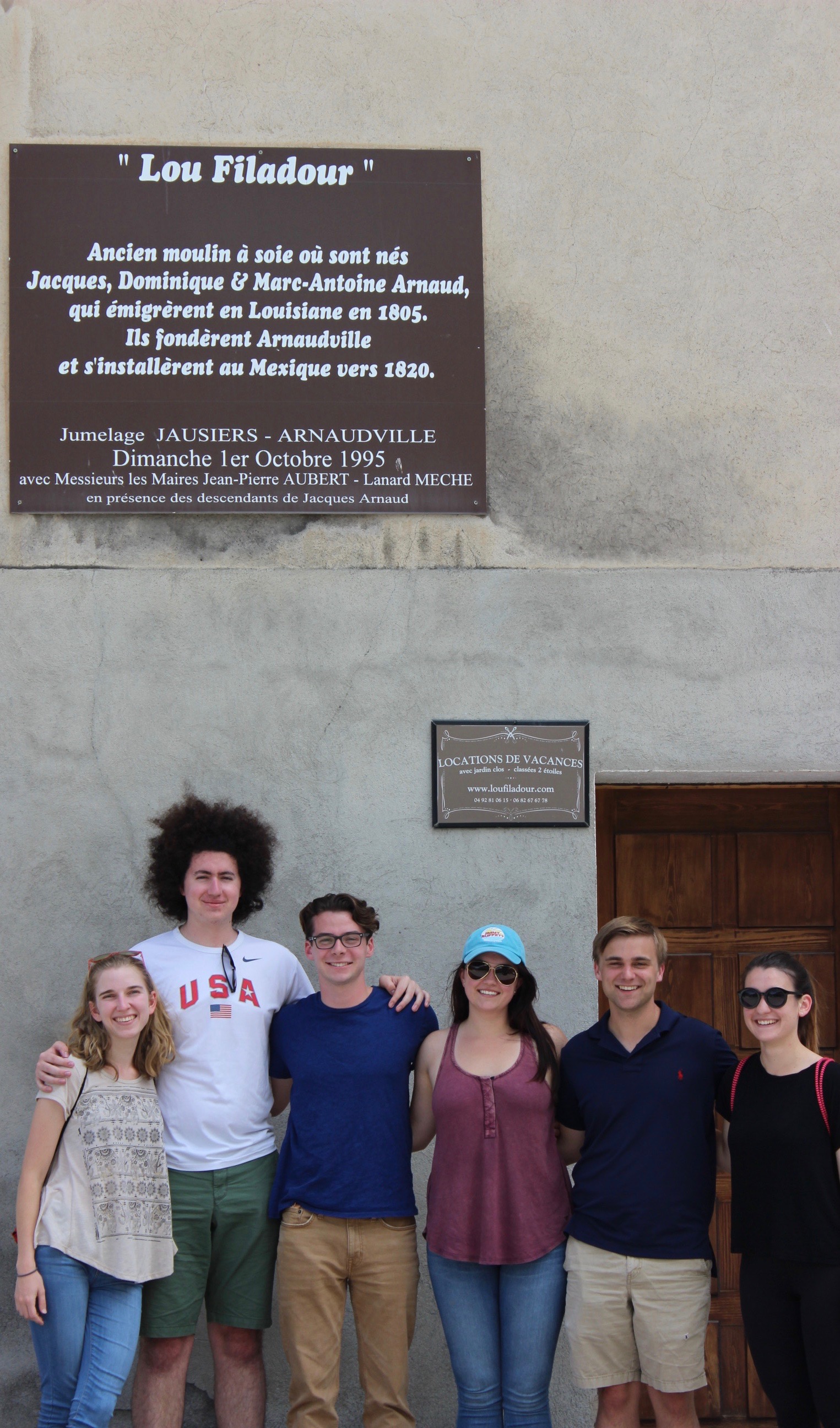 LSU students taking a tour and pausing in front of a monument in the Ubaye Valley program