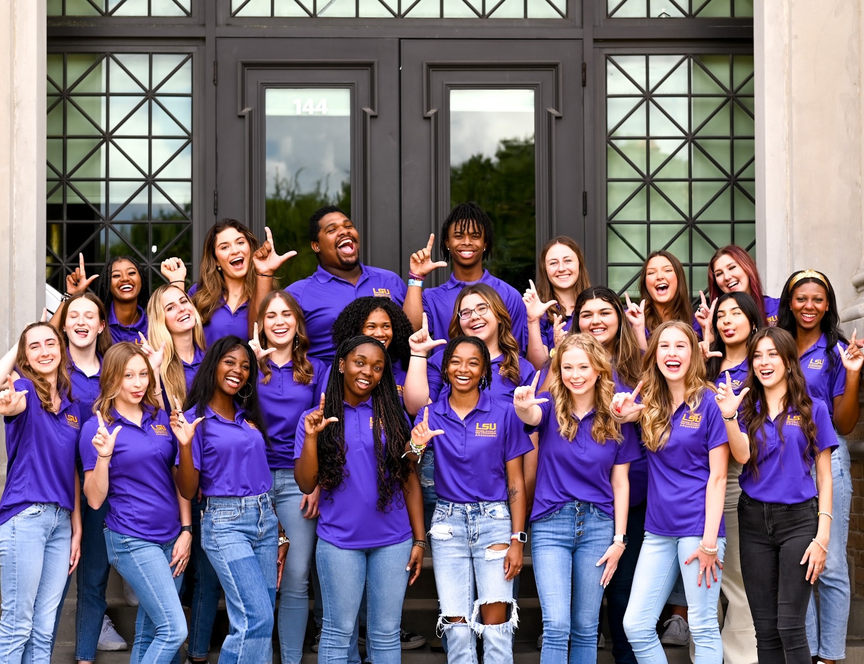 Photo of the Manship Ambassadors posing in front of the Journalism Building Photo of the Manship Ambassadors posing in front of the Journalism Building