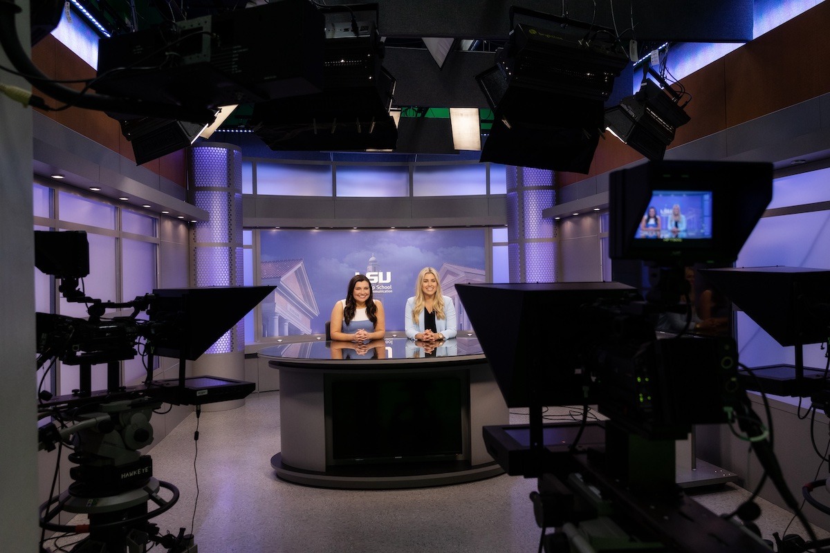 Students sitting at TigerTV desk Students sitting at TigerTV desk