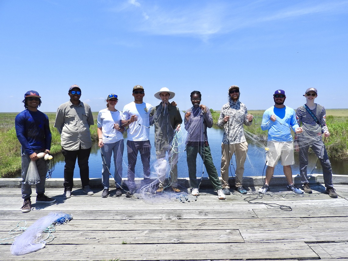 Group of students posing for a photo on a field trip.