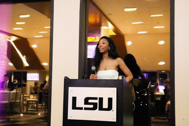 student speaking into microphone student speaking into microphone